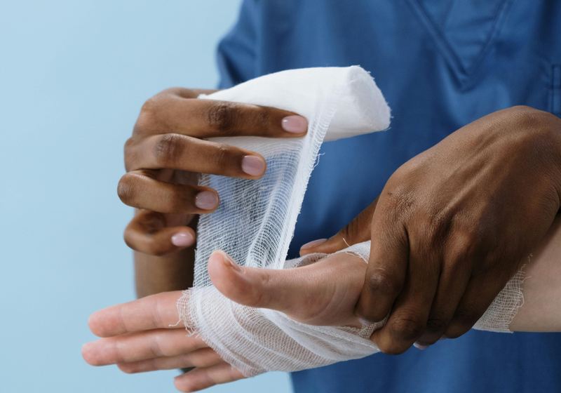 Clinician treating an injured patient